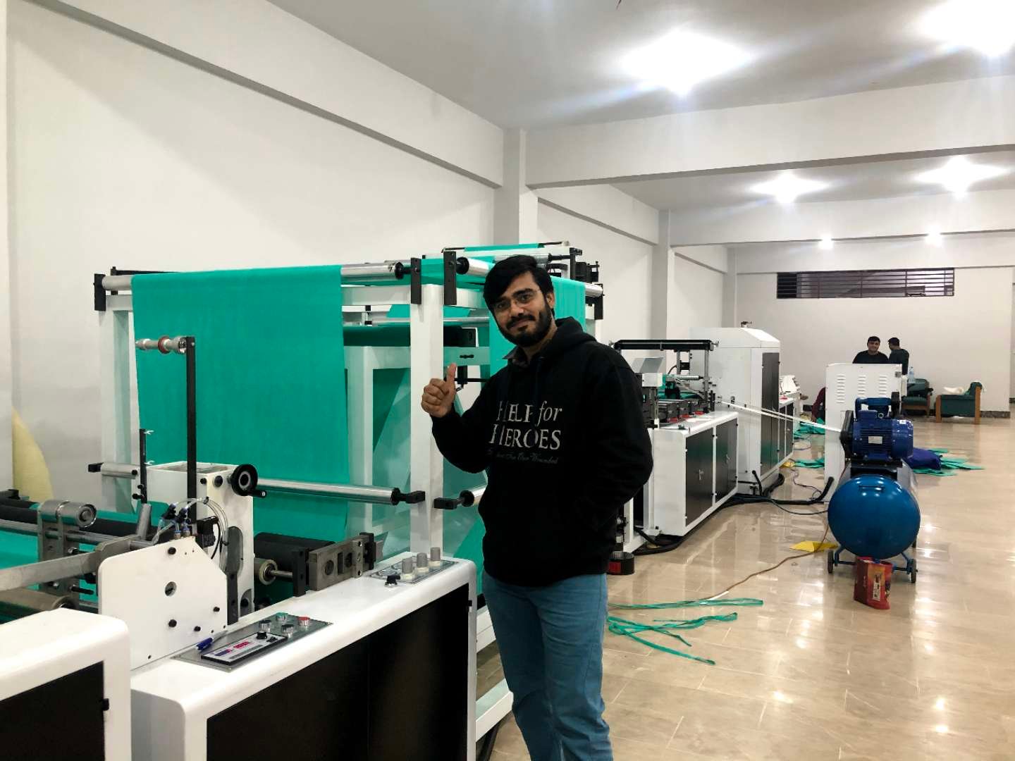 Client running a ZHENGWEI machine for non-woven bag production
