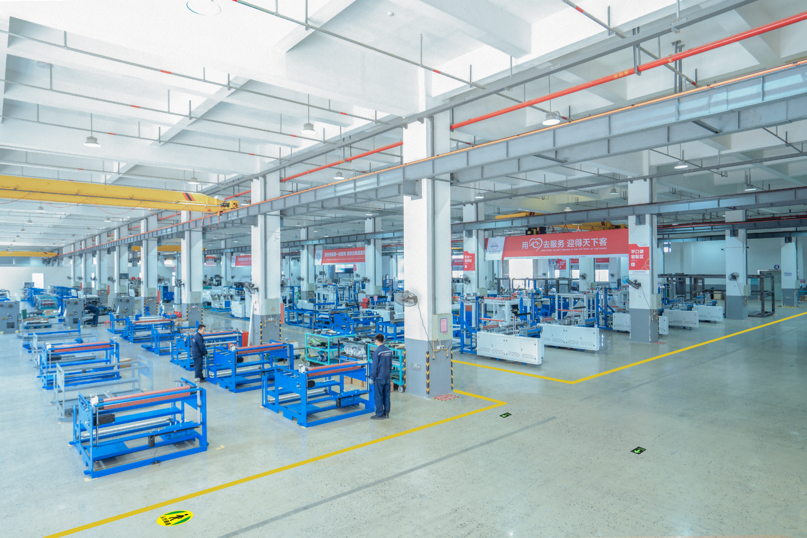 ZHENGWEI technicians assembling a seamless paper bag making machine
