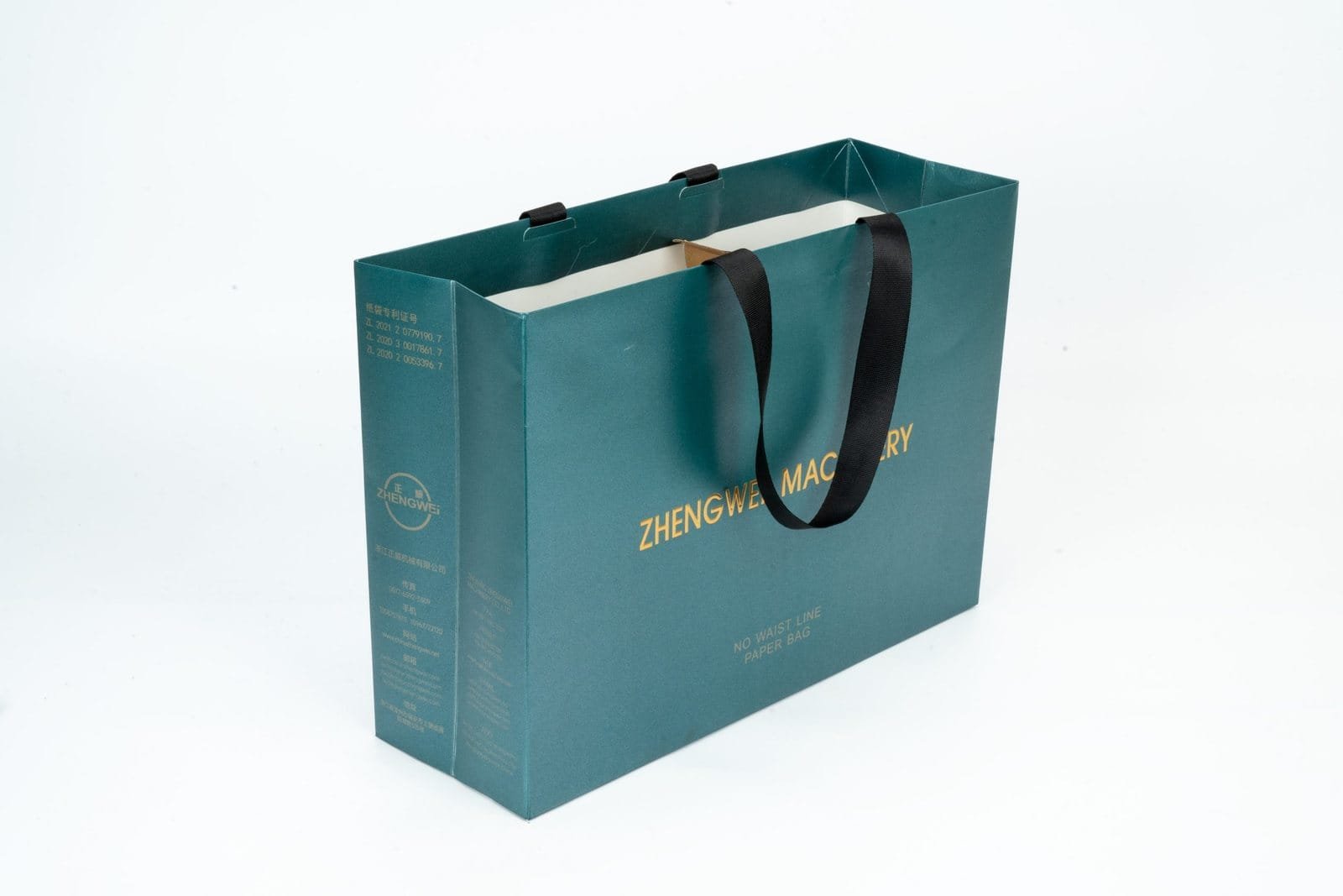 Teal paper bag sample with printed branding and dark ribbon handles