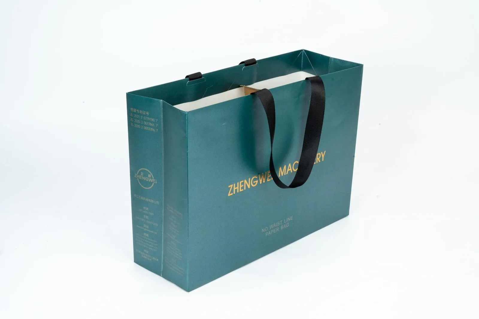 Teal paper bag sample with printed branding and dark ribbon handles
